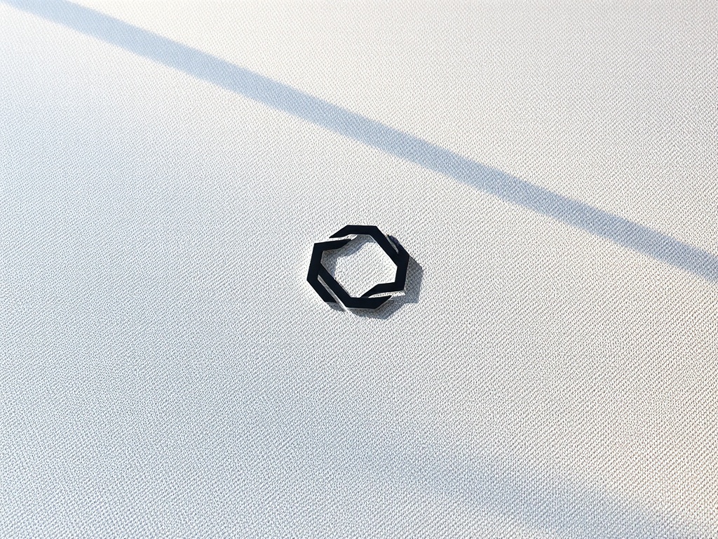 Minimalist geometric logo mockup on a textured linen fabric, soft shadows, high-end branding style, photorealistic 8k